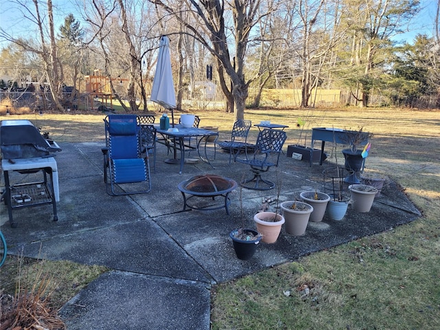 view of patio / terrace featuring grilling area and an outdoor fire pit