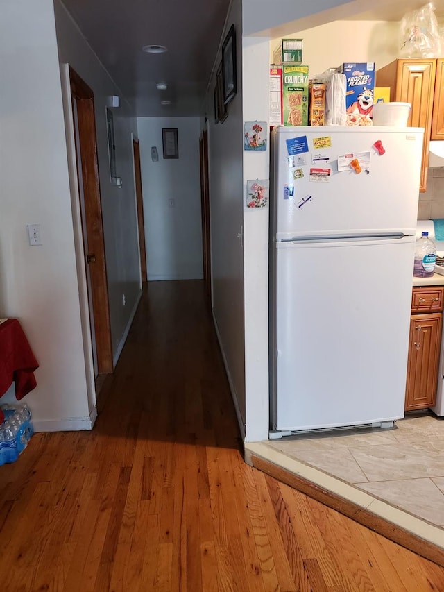 hallway with light wood-type flooring