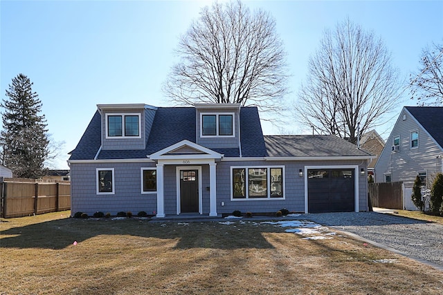 view of front facade featuring a garage and a front lawn