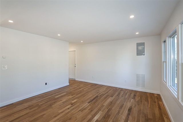 empty room featuring dark wood-type flooring