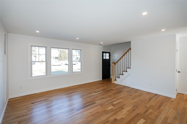 empty room featuring hardwood / wood-style flooring