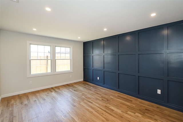 spare room with light hardwood / wood-style floors