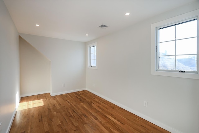 unfurnished room featuring hardwood / wood-style floors