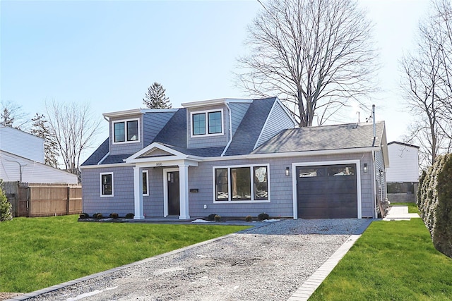 view of front facade with a garage and a front yard