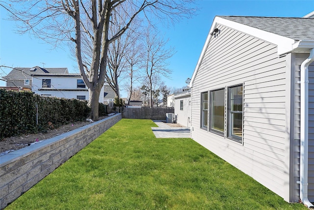 view of yard featuring central AC and a patio area