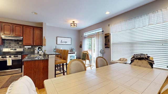 dining space featuring recessed lighting