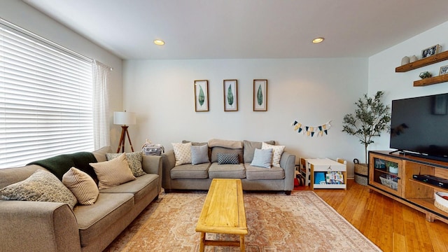 living room featuring recessed lighting and light wood-style flooring