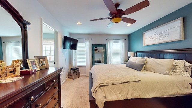 bedroom featuring baseboards, recessed lighting, light carpet, and a ceiling fan