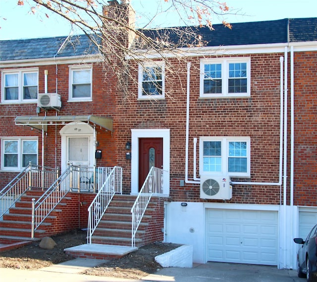 townhome / multi-family property with a garage