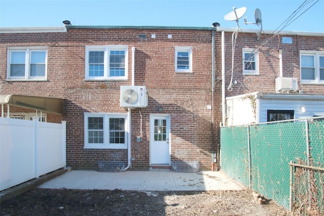 rear view of property featuring a patio