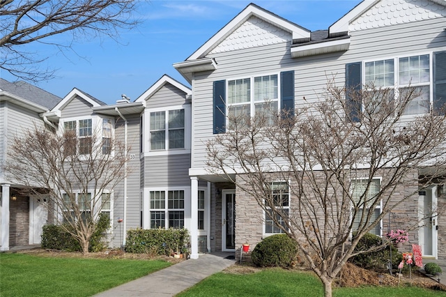 view of property featuring a front yard