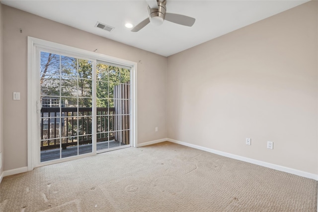 unfurnished room with carpet and ceiling fan