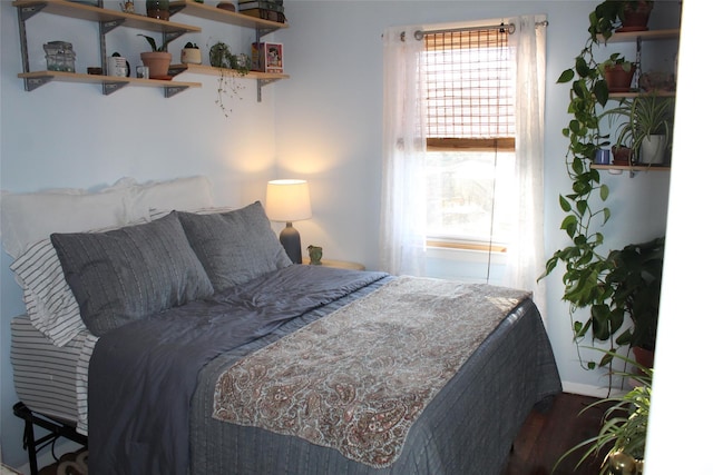 bedroom with hardwood / wood-style floors