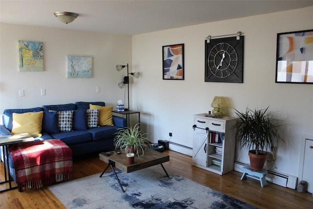 living room featuring a baseboard heating unit and wood-type flooring