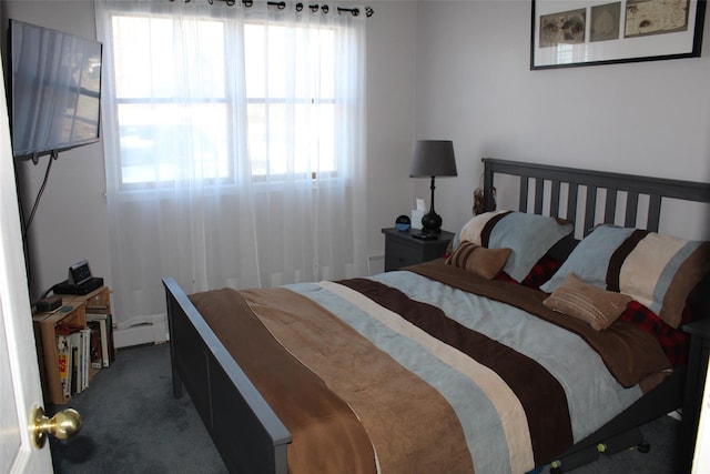 carpeted bedroom featuring a baseboard radiator