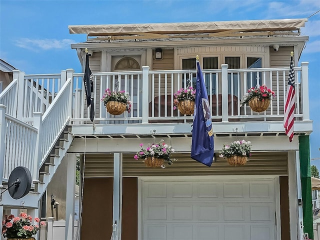 back of house featuring a garage