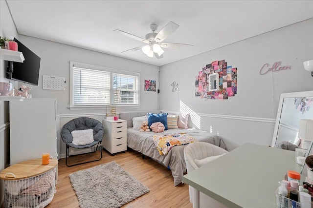 bedroom with ceiling fan and light wood-type flooring