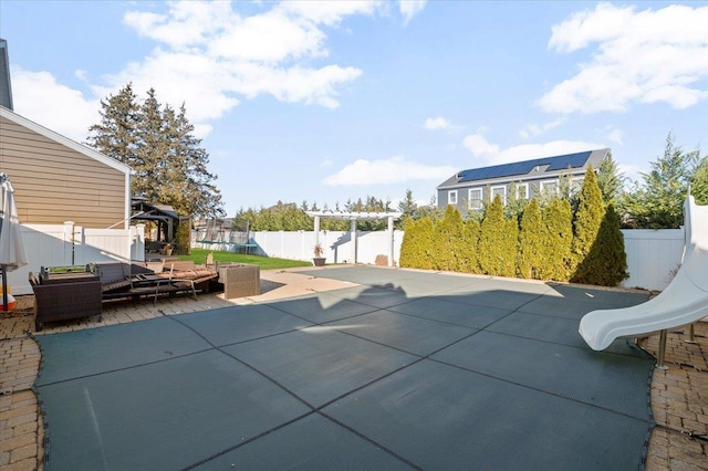 view of pool featuring an outdoor living space, a pergola, and a patio area