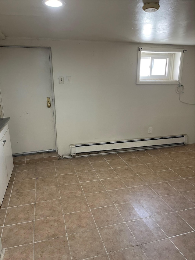 interior space featuring a baseboard radiator and tile patterned flooring