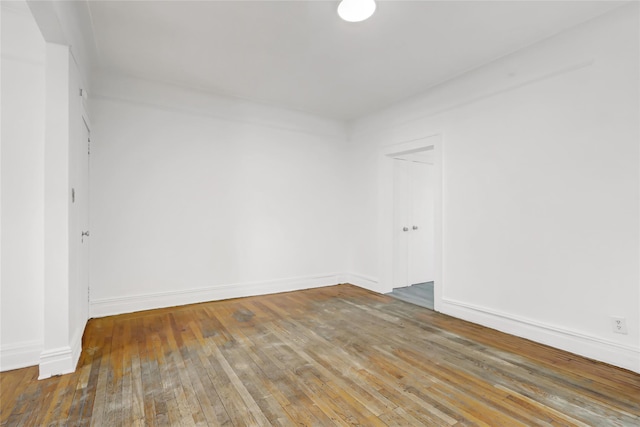 spare room with hardwood / wood-style floors