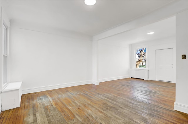 spare room with hardwood / wood-style flooring