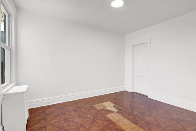 empty room featuring dark parquet floors