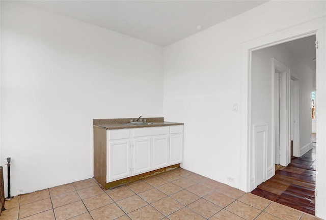 interior space with tile patterned floors and sink