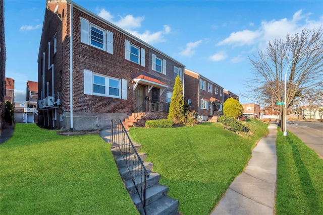 view of front of property with a front lawn