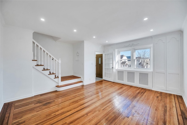 unfurnished living room featuring light wood-type flooring