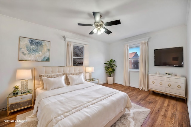 bedroom featuring wood-type flooring and ceiling fan