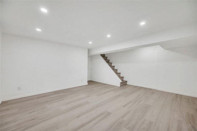 basement featuring light wood-type flooring