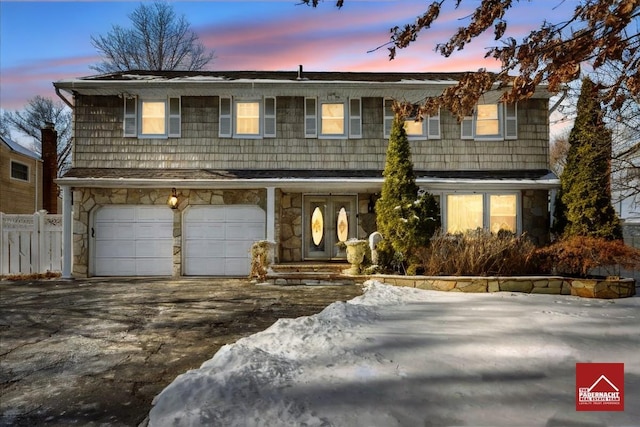 front of property with a garage