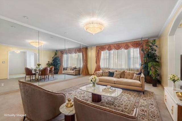 living room featuring ornamental molding and light carpet