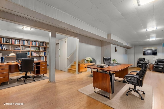 office with light hardwood / wood-style flooring