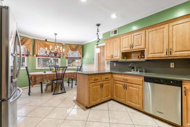 kitchen featuring sink, decorative light fixtures, light tile patterned floors, appliances with stainless steel finishes, and kitchen peninsula