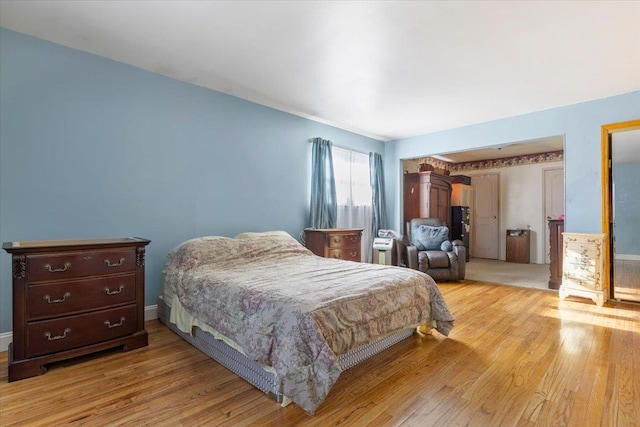 bedroom with light hardwood / wood-style flooring