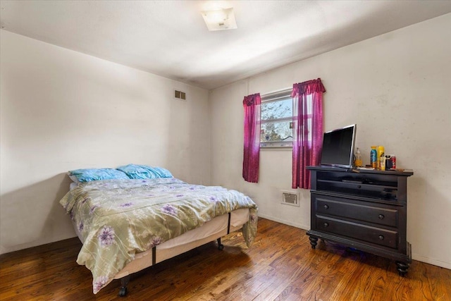 bedroom featuring dark hardwood / wood-style floors