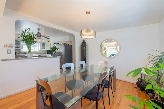 dining room featuring ceiling fan and light hardwood / wood-style floors