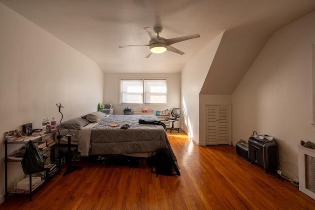 bedroom featuring radiator, wood-type flooring, and ceiling fan