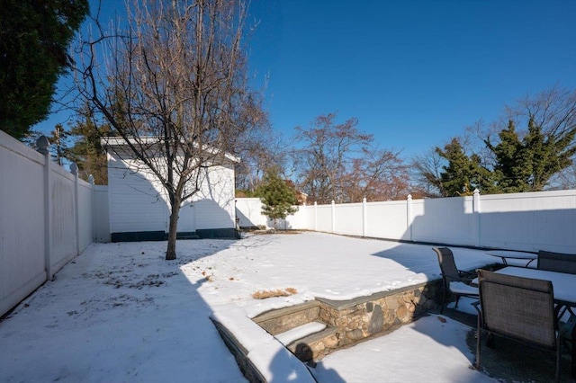 view of yard covered in snow