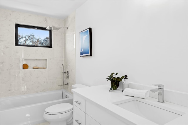 full bathroom with vanity, toilet, and tiled shower / bath