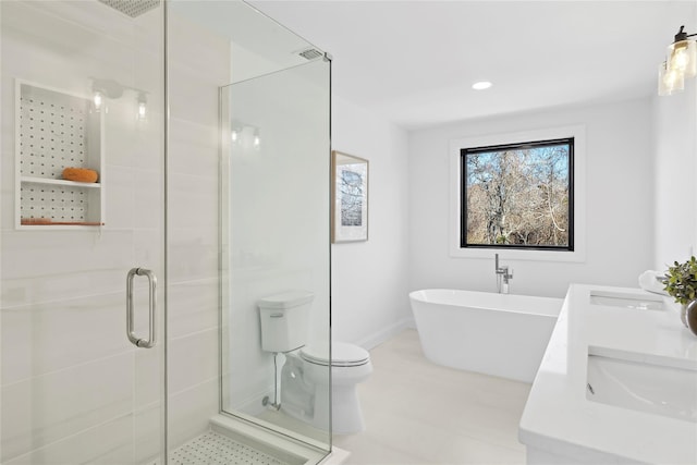 full bathroom featuring vanity, toilet, and separate shower and tub