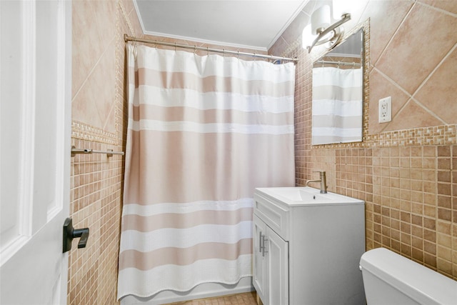 bathroom with tile walls, vanity, crown molding, and a shower with shower curtain