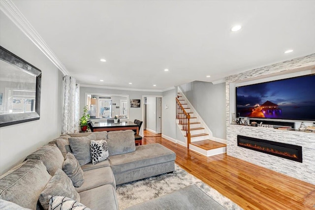 living room with ornamental molding and wood-type flooring