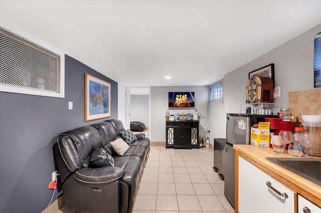 tiled living room featuring wet bar