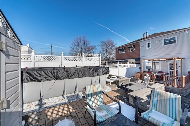 view of patio / terrace with a covered pool