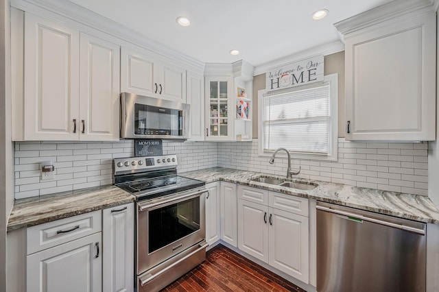 kitchen with sink, dark hardwood / wood-style floors, white cabinets, and appliances with stainless steel finishes