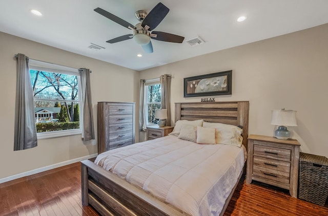 bedroom with dark wood-type flooring and ceiling fan