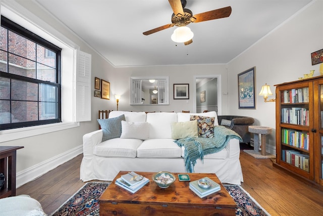 living room with crown molding, hardwood / wood-style flooring, and ceiling fan