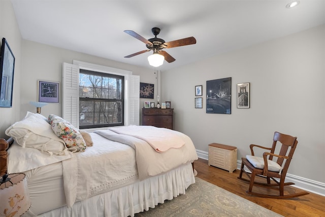 bedroom featuring hardwood / wood-style floors and ceiling fan